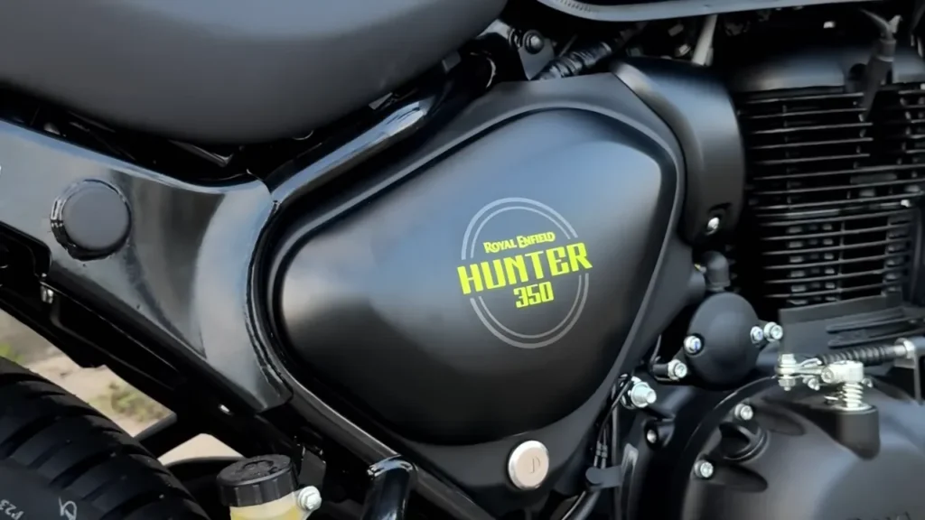 Royal Enfield Hunter 350 Graphite Grey with neon yellow accents parked on Indian city street