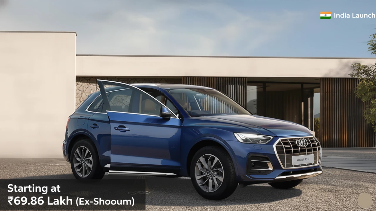 Blue Audi Q5 Signature Line SUV parked in front of a modern house, with the driver's door slightly open. Text overlay highlights 'Starting at ₹69.86 Lakh (Ex-Showroom)' and 'India Launch', emphasizing the Audi Q5 Signature Line Price India for the new limited edition model."