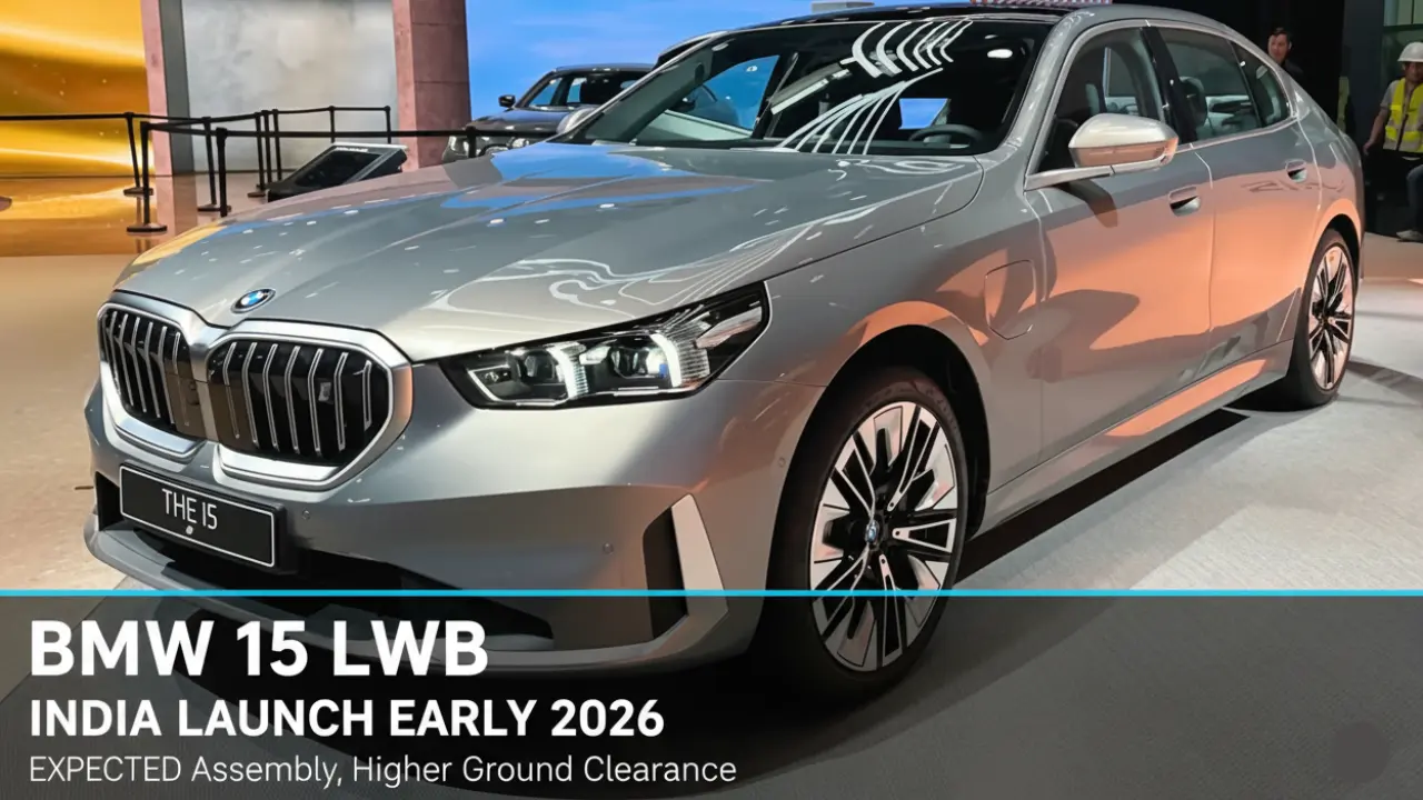 "Silver BMW i5 LWB India at an event with launch graphics. The image highlights the distinctive grille, alloy wheels, and the 'THE i5' badge, confirming the long-wheelbase electric sedan's early 2026 launch."